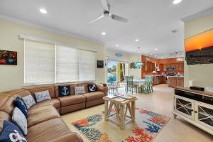 a living room with a couch and a table at Casa Mar in Islamorada