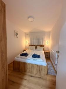 a bedroom with a large bed in a room at Apartman Krznarić Centar in Županja