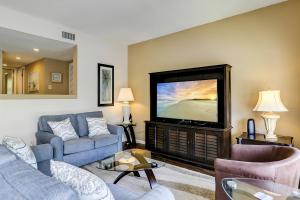 a living room with a couch and a flat screen tv at Anchorage 7442 in Hilton Head Island