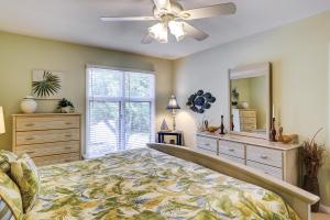 a bedroom with a bed and a ceiling fan at Anchorage 7442 in Hilton Head Island +32 photos