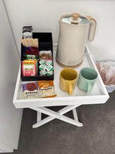 a white shelf with food and a blender on it at Woodlands Banff in Banff