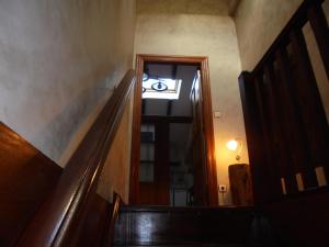 a hallway with a door leading to a stairway at Caserío Areitz Soroa in Arce