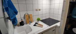 a bathroom with a sink and a tub with a sink at Studio en campagne in Retournac