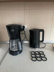 a coffee maker and a coffee pot on a counter at Apartment Akanthous in Kallithea Halkidikis