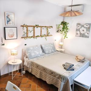 a bedroom with a bed and two tables at Casale la Decima in Budrio