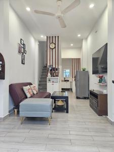 a living room with a couch and a table at LoCo Fully Equipped House - 2BR3WS in Ho Chi Minh City