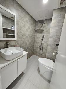 a white bathroom with a sink and a toilet at LoCo Fully Equipped House - 2BR3WS in Ho Chi Minh City +29 photos