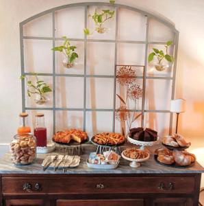 a buffet with different types of food on a table at Casale la Decima in Budrio