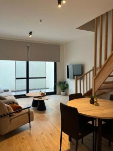 a living room with a couch and a table at FDS Luxe House in Ghent