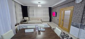 a dining room with a table and a chair at Onur Termal in İhsaniye +2 photos