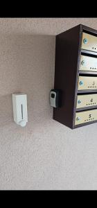 a wall with drawers and a box on the wall at Tautiului 222 apartment in Floreşti +4 photos