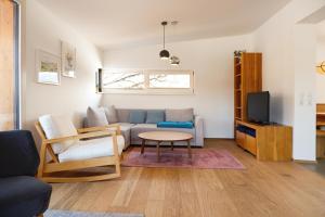 a living room with a couch and a table at Haus Gerti in Ramsau am Dachstein