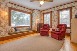 a living room with two chairs and a window at The Greenfield in Bethlehem