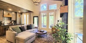 a living room with a couch and a table at The Pointe Guesthouse in Texanna