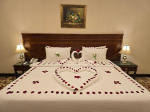a bed with two hearts on top of it at Taj Celine Hotel in Jeddah