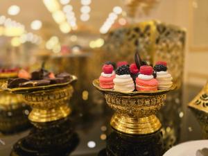 a group of desserts sitting on top of a table at Taj Celine Hotel in Jeddah