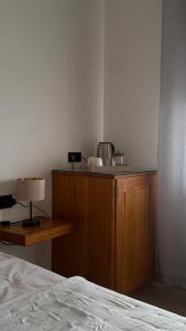 a bedroom with a bed and a table with a lamp at Yellow Room - Sunlite Double Private Room in Villa Barbuja in Tefía