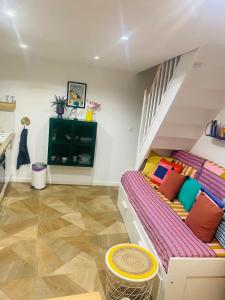 a bedroom with a bunk bed with a staircase at Duplex house with small terrace in Bayeux