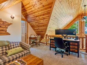 a living room with a computer and a desk at Sunset Serenity on Kego Lake in Fifty Lakes