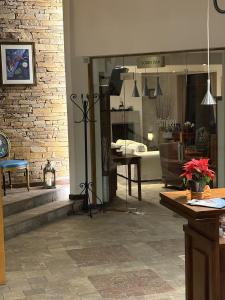 a living room with a brick wall and a window at Hotel Smilen in Smolyan +31 photos