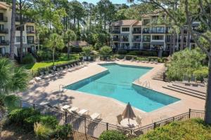 an image of a swimming pool at a resort at Beachside Tennis 1869 in Hilton Head Island