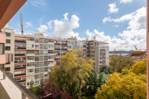 a view of a large apartment building from a balcony at Lisbon at Home in Lisbon