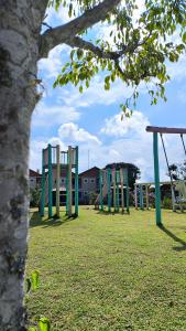 a row of empty chairs in a park at Pousada Lusitânia in Pedra Azul