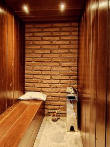 a corner of a room with a brick wall at CasaVid - Private Boutique Chalet & Spa - Vistas 360 in Tafí del Valle