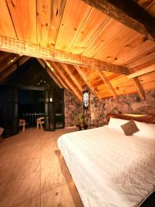 a bedroom with a bed in a room with wooden ceilings at Bosque de Perlillas in Mexico City +38 photos