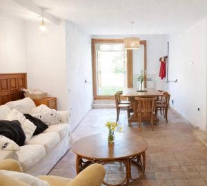 a living room with a couch and a table at Santocasale in Rocca di Mezzo