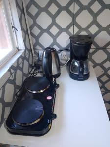 a black appliance sitting on top of a counter at Espacio de relax in Trapiche