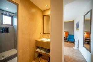 a bathroom with a sink and a mirror and a tub at Saska Boutique Hotel in Cusco +172 photos