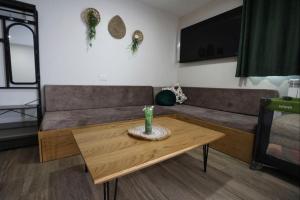 a living room with a couch and a coffee table at להנות מהטבע שמס in Majdal Shams
