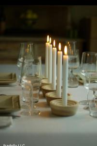 a table with candles and glasses on a table at Nubian oasis hotel in Aswan