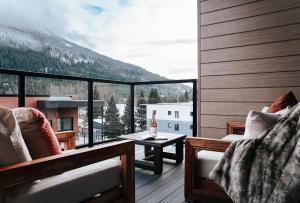 a balcony with a view of a mountain at Cloudscape Penthouse by Revelstoke Vacations in Revelstoke