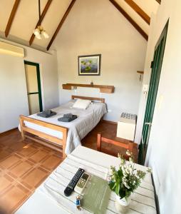 a room with a bed and a table with a desk at Annemarie Apart in Villa Paranacito