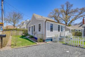 a white house with a white fence at Modern Design - Walk to Galleries + Beach + Dining in Provincetown