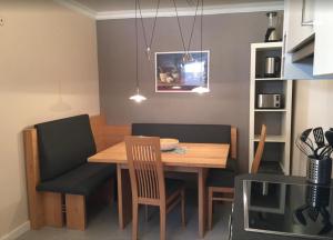 a dining room with a wooden table and chairs at Ferienwohnung Würzburg, Würzburg Sanderau in Würzburg +47 photos