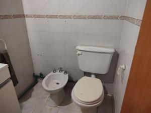 a bathroom with a white toilet and a bidet at Lo de Norma in Neuquén +9 photos