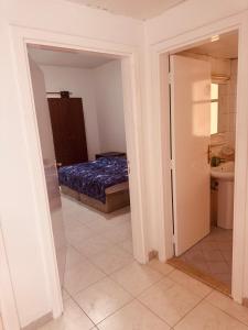 a bedroom with a bed and a bathroom at Bedroom separately in Sharjah