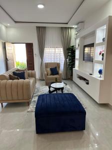 a living room with two couches and a coffee table at Silverest Place in Lusaka