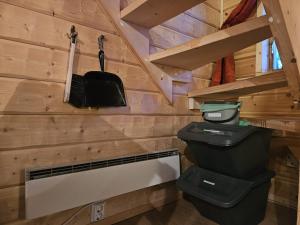 a tiny house with a toilet and stairs at The Lakeview Cabin in Kiruna +27 photos