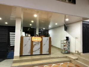 a store front with a sign on the wall at HOTEL DEL MINERO Otanche in Otanche