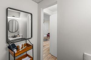 a bathroom with a mirror and a sink at Pigeon Forge Home in Pigeon Forge +11 photos