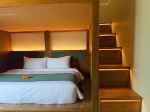 a bedroom with a bed and a bunk bed at Leafy Riverbank in Tabanan +23 photos