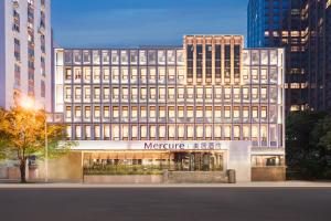 a large office building with a meyer at Mercure Beijing Dongzhimen in Beijing