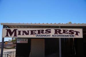a sign on the front of a farmers restowmentowmentstrationstrationstrationstrationstration at Miners Rest Units in Mount Magnet +2 photos