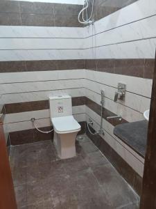 a bathroom with a toilet and a sink at HOTEL SHREE JMM Mount View in Udaipur