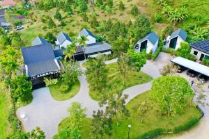 an overhead view of a house with a yard at Annrin cafe & Resort in Ban Song Phi Nong +20 photos