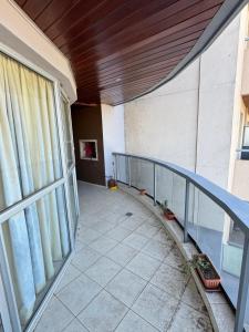 a balcony of a building with a large window at Dos D Point "pleno centro" in Río Tercero